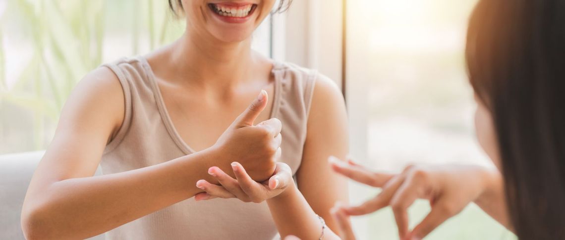 Two people using sign language