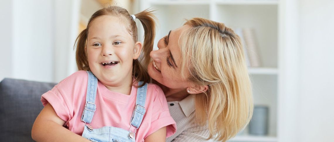 Woman hugging young child