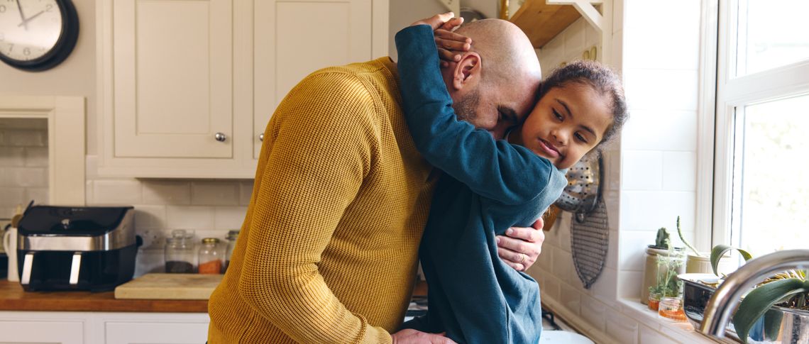 young child hugging parent